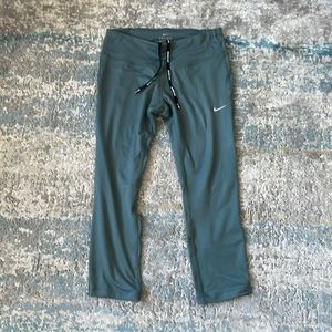 Lightly used Nike leggings with mesh and reflective dots on the back